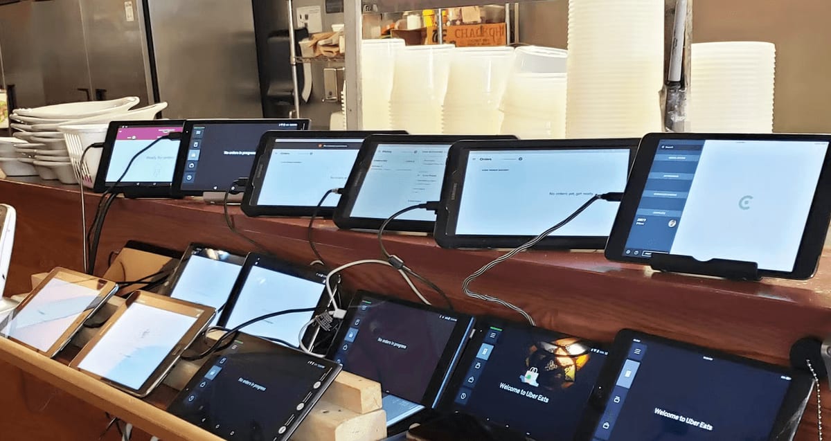 Collection of tablets and devices representing a fragmented restaurant technology stack