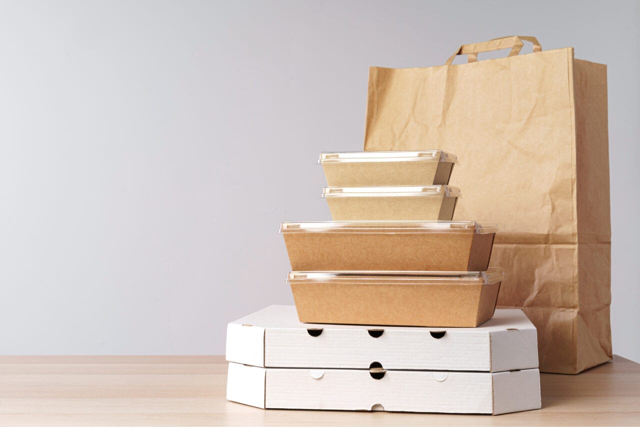 Restaurant staff managing a synced delivery menu
