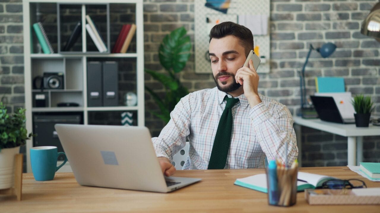 Manager reviewing restaurant operations on a laptop